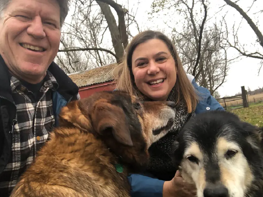 Dave Moore and Elissa Slotkin played with their dog Dakota and Dixie on the Slotkin family farm in Holly Mich on Nov 6, 2018.  