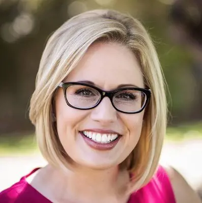 Kyrsten Sinema's serving as a member of the Democratic party,