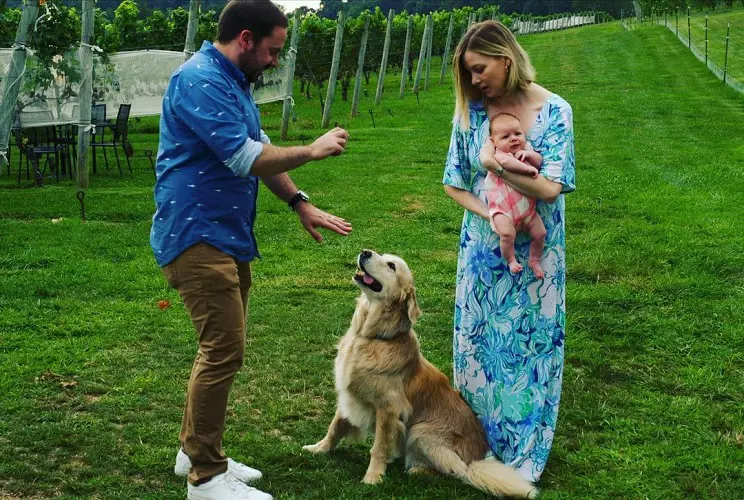 The picture of Kristen Soltis Anderson with her husband daughter and a beautiful daughter in the Vineyard