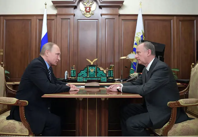 Russian President Vladimir Putin, left, meets with Nikolai Patrushev, the head of Russia’s Security Council | Mikhail Klimentyev/Reuters