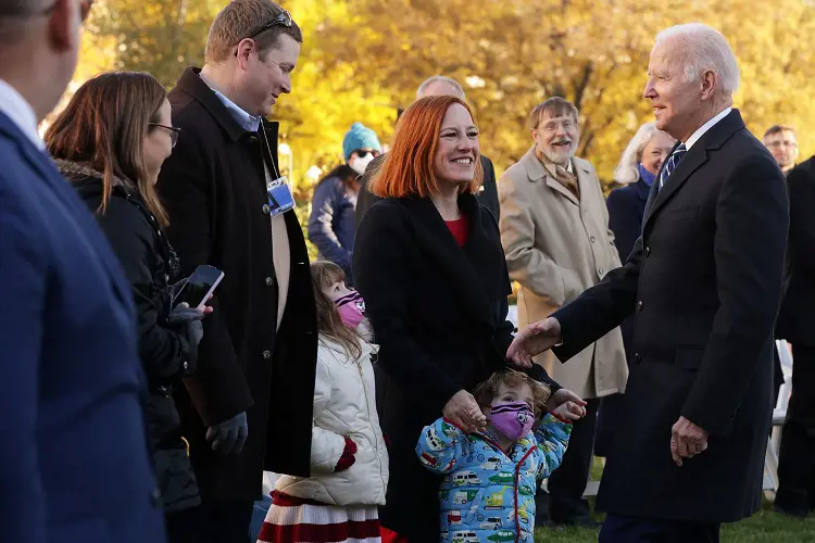 US President Joe Biden (right) greets Jen Psaki and her husband Gregory Mecher (Left) at the 74th National Thanksgiving Turkey presentation on Friday, November 19, 2021. 