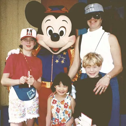young Peter Meijer with his mother and siblings at Disney world as well as Mickey Mouse Mascot