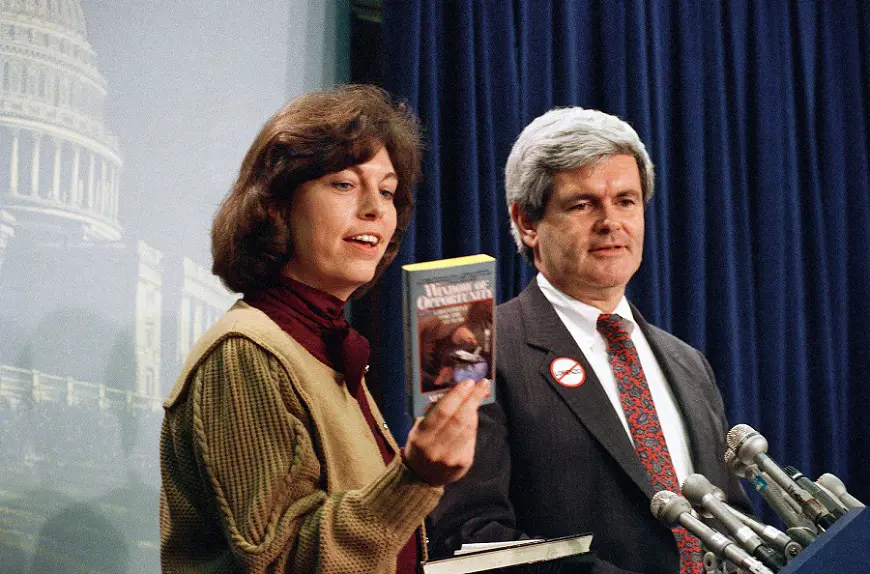  Newt Gingrich looks on as his wife Marianne holds up a copy of their book, during a news conference, March 20, 1989 in Washington. 