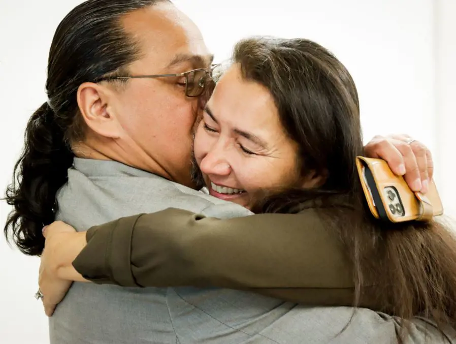 Mary hugs her husband, Gene “Buzzy” Peltola, after learning she had won Alaska’s special U.S. House race.