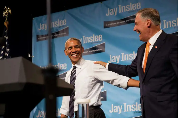 Governor Jay Inslee and President Barack Obama laugh following their speeches at a Democratic fundraiser at the Washington State Convention Center on Friday, June 24, 2016.